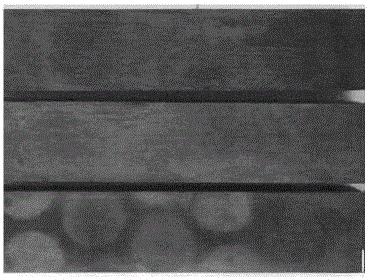 Economic HIC-resistant X90 pipeline steel plate and manufacturing method thereof