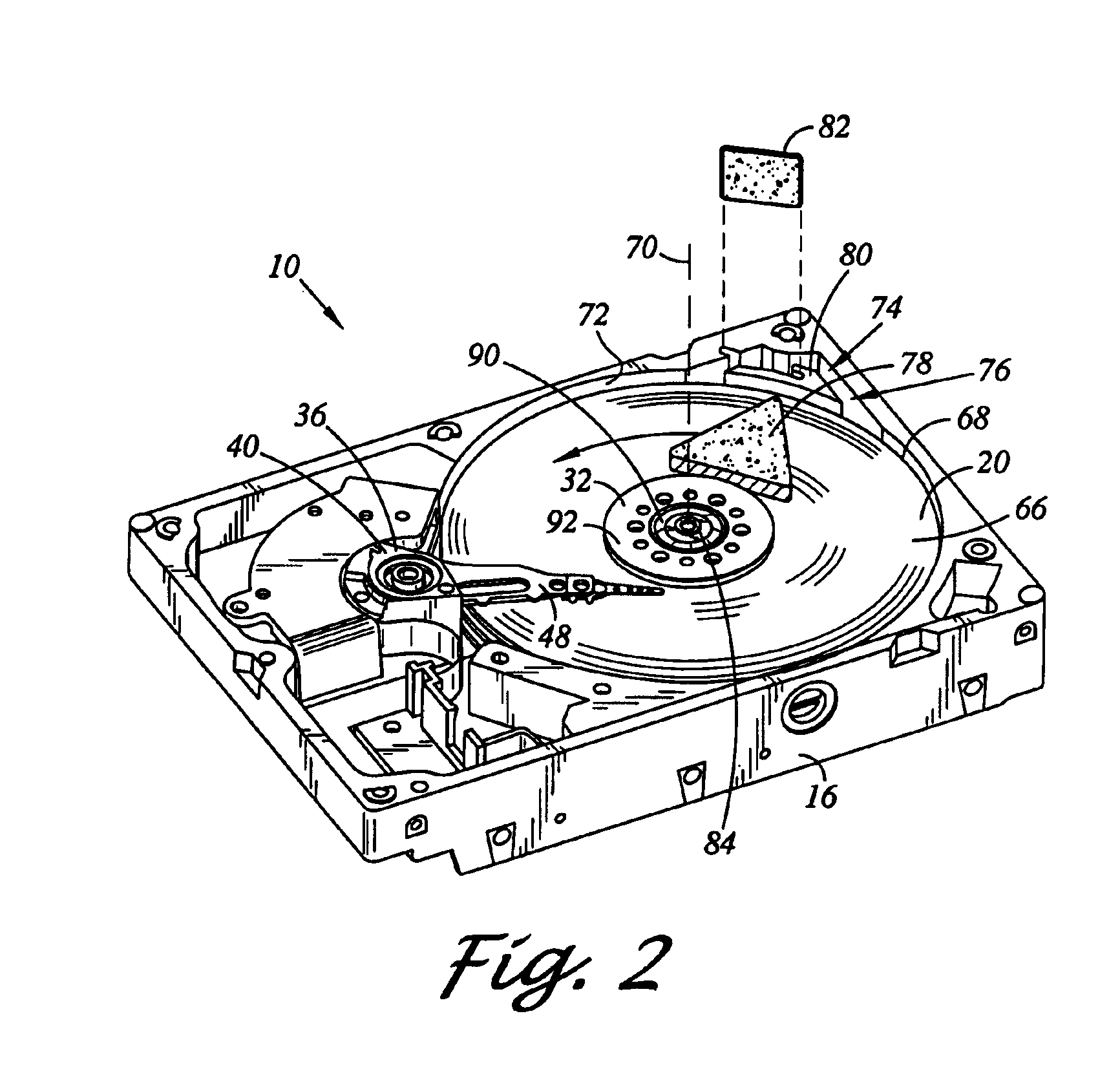 Disk drive including an airflow diverter element radially between spindle motor axis of rotation and cavity in shroud surface