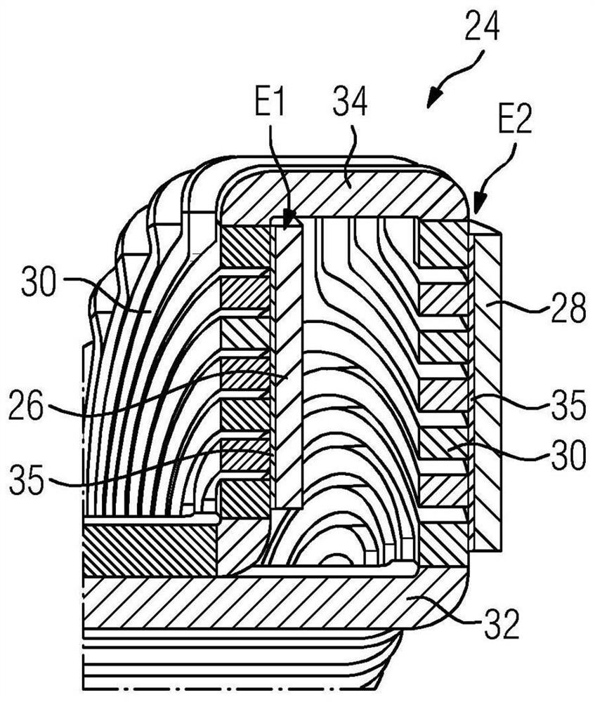 Winding head arrangement for electric rotating machine