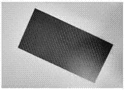 Method of recovering carbon fibers by low-temperature microwave efficient treatment of carbon fiber composite material