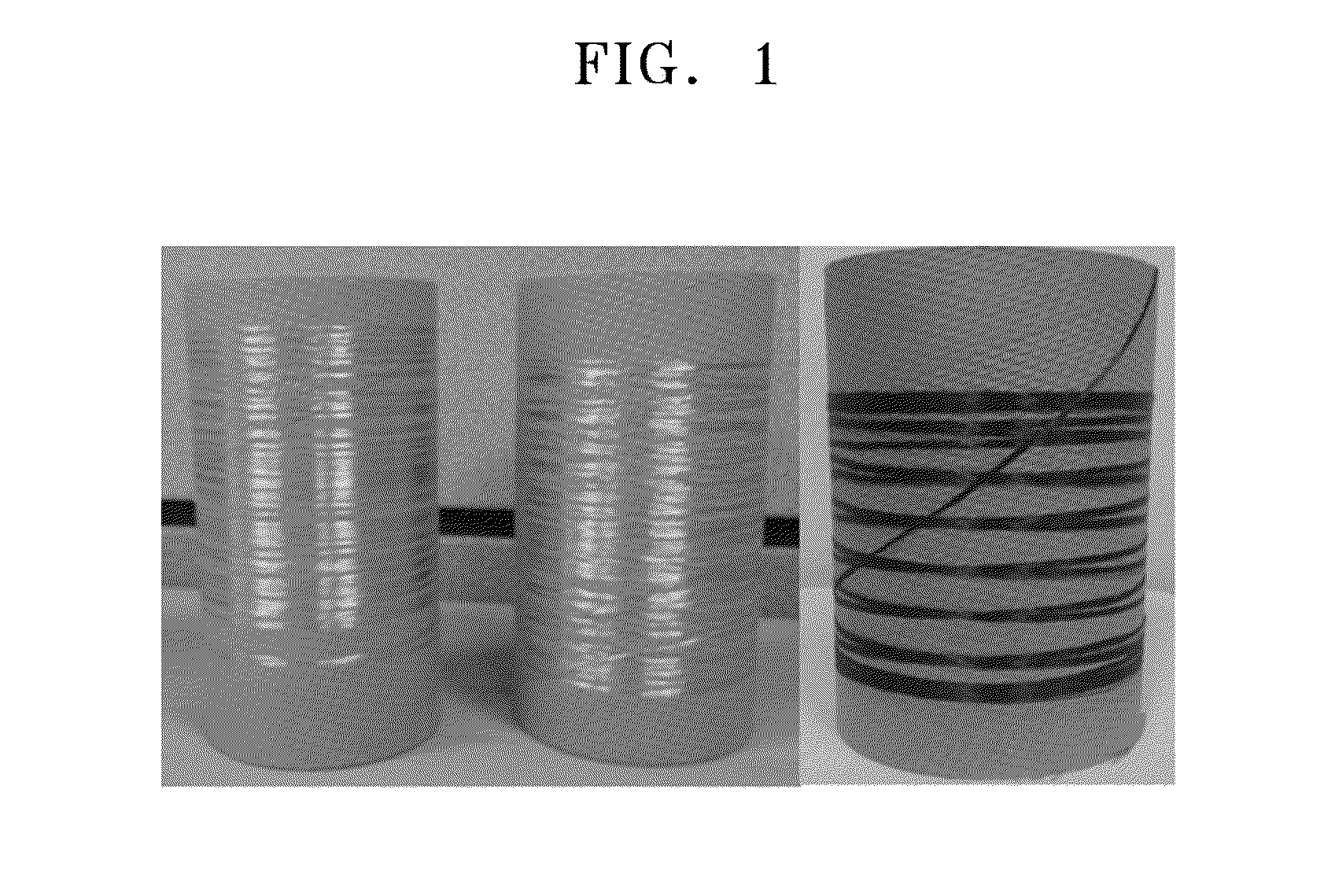 Method of preparing carbon fiber from wood waste including adhesive