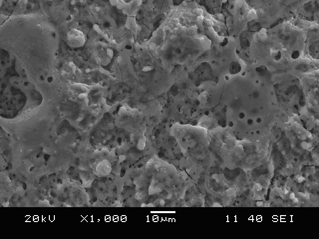 Preparation method of titanium alloy/biological ceramic layer composite material