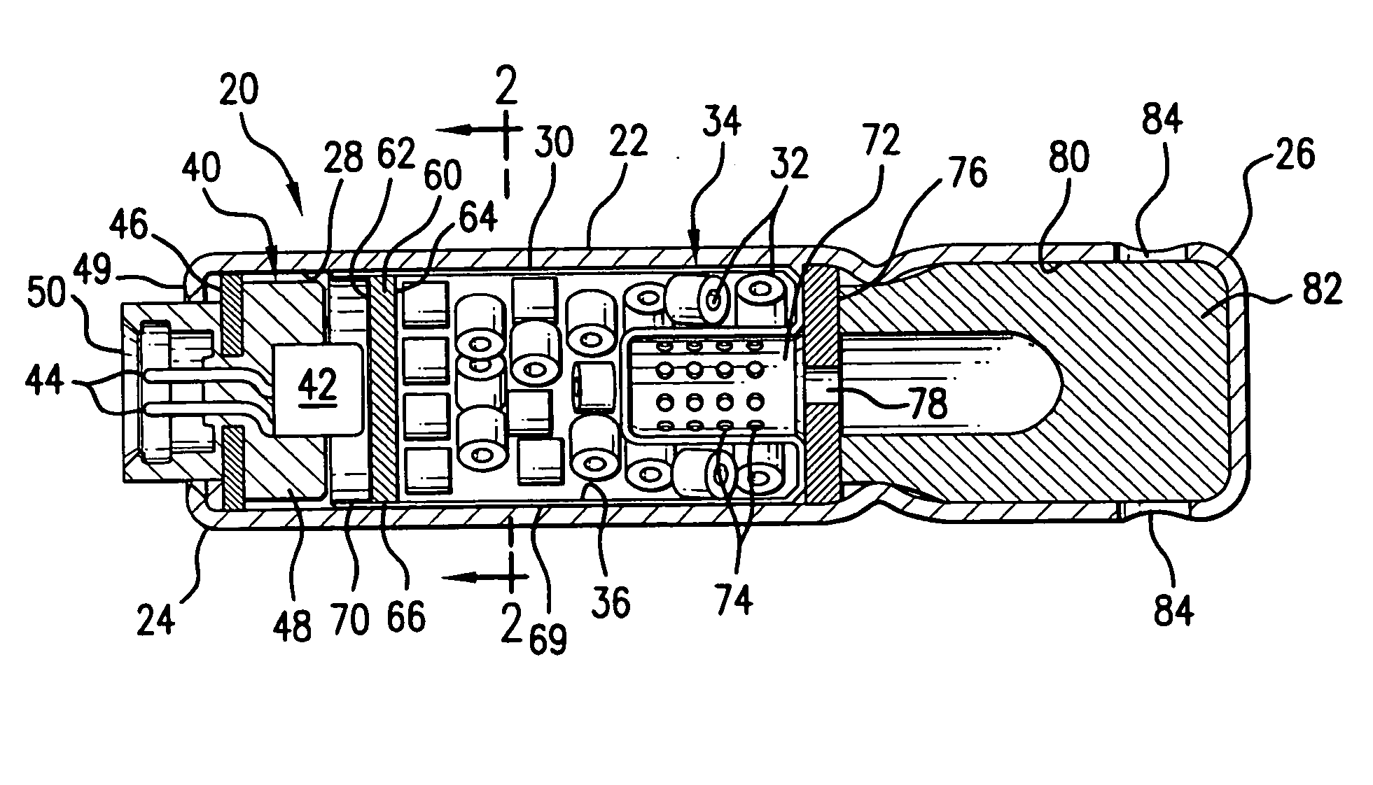 Inflator devices having a moisture barrier member