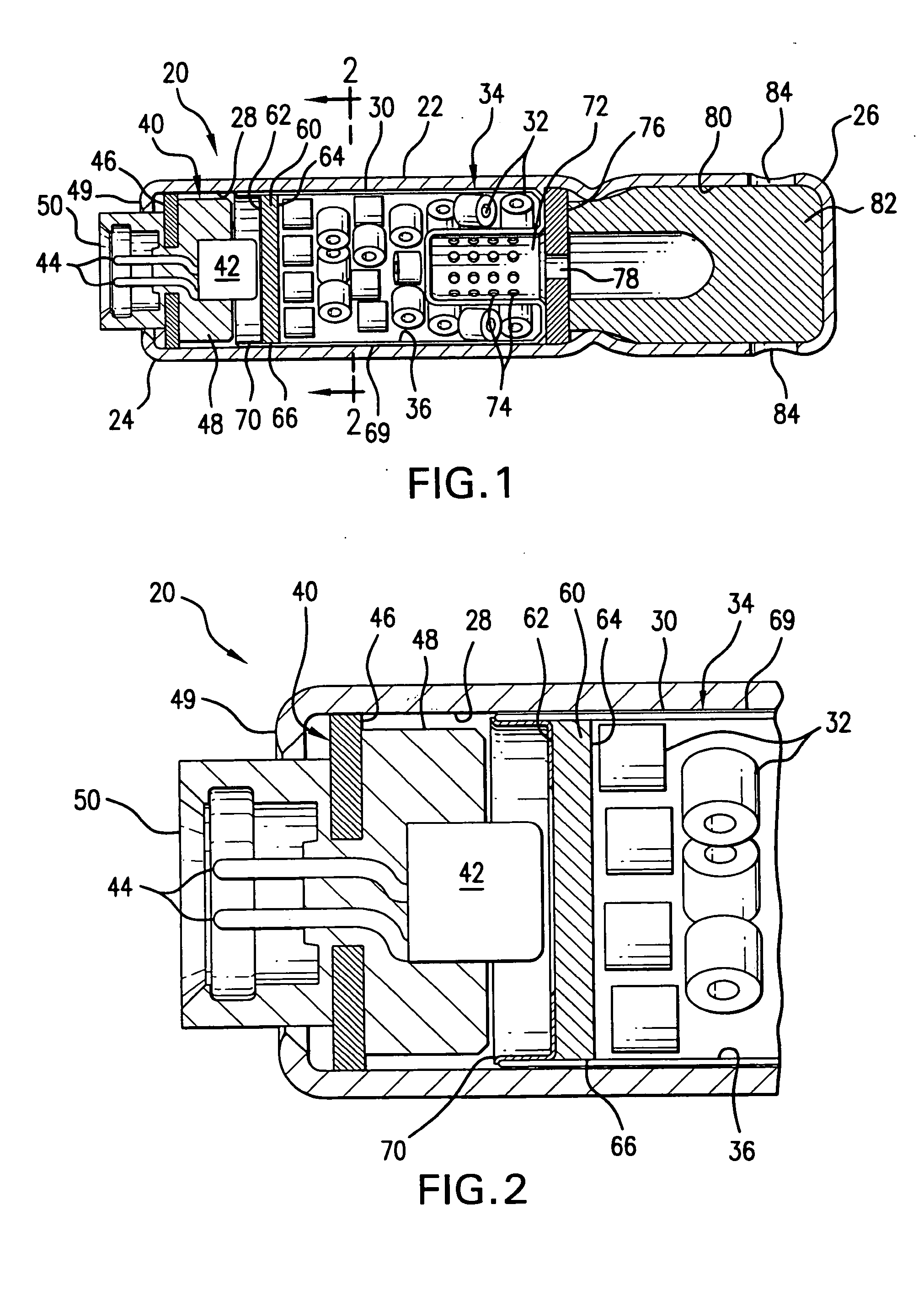 Inflator devices having a moisture barrier member