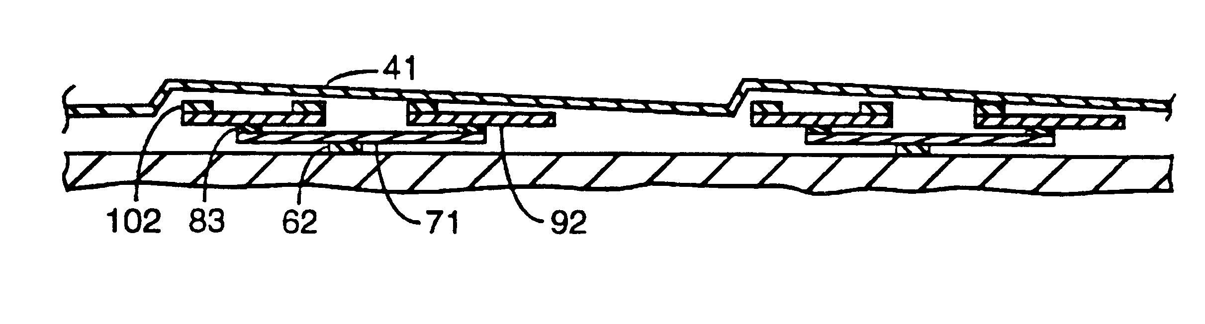 Compliant foil fluid film thrust bearing with a tilting pad underspring