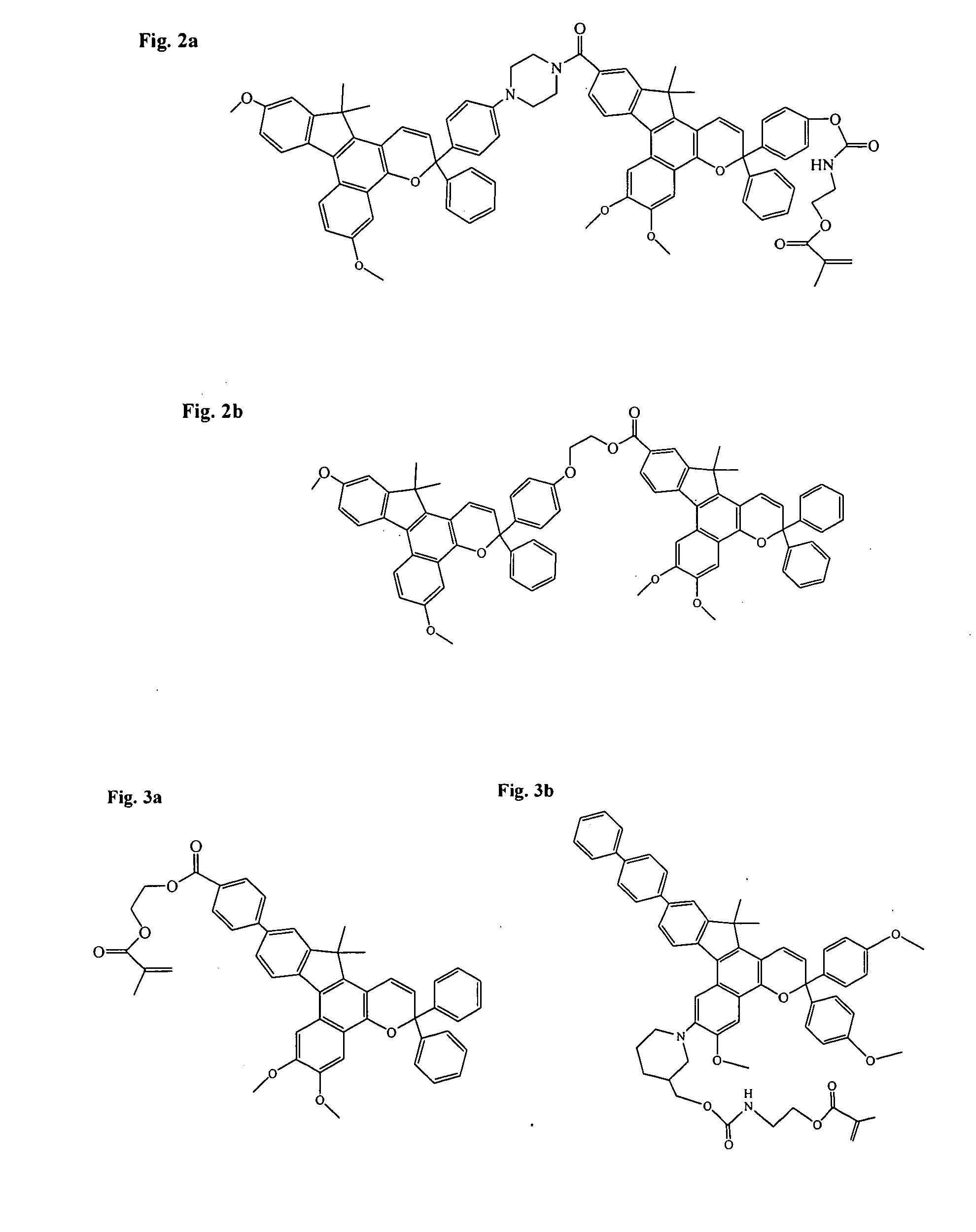 Ophthalmic devices comprising photochromic materials having extended pi-conjugated systems