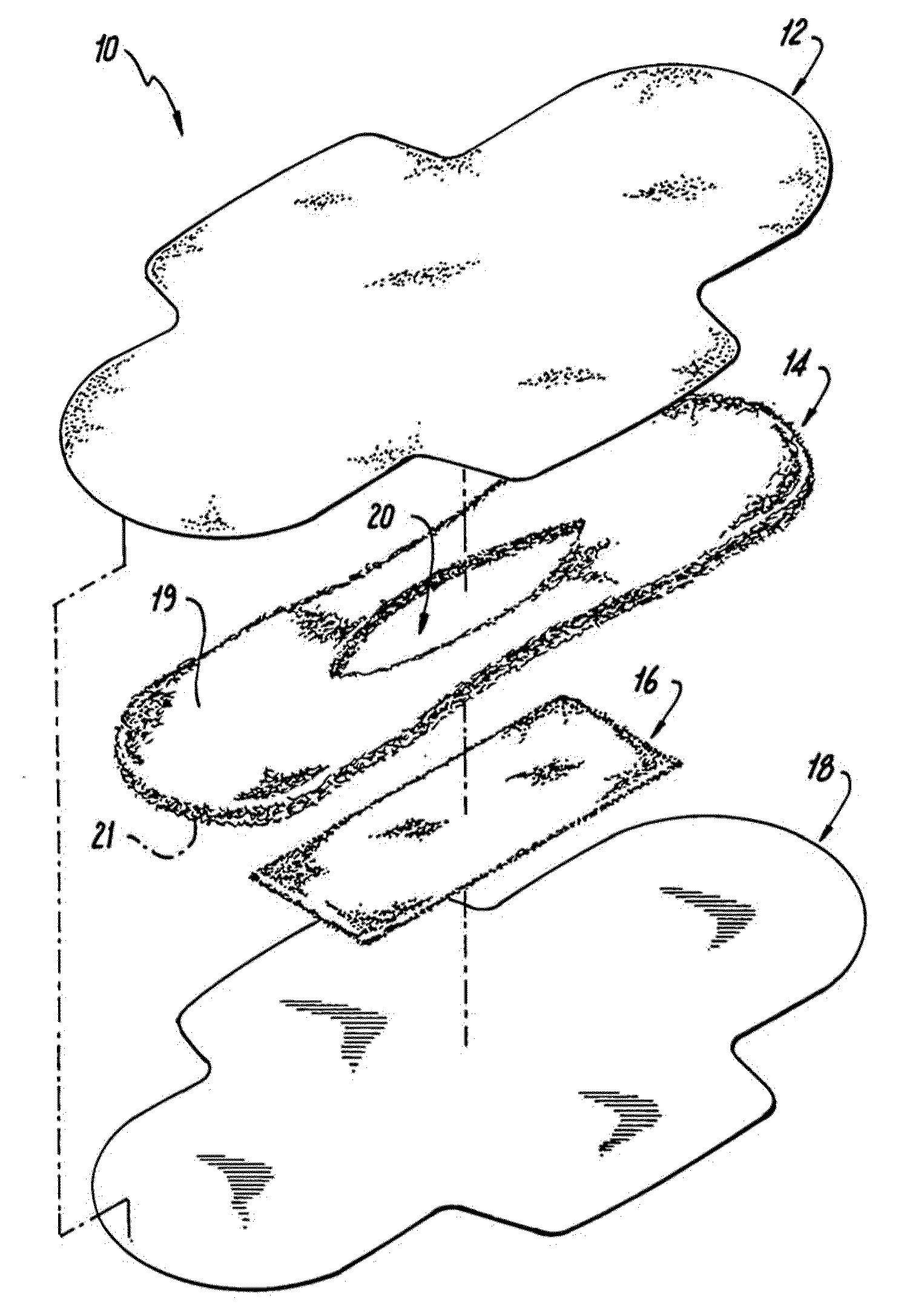 Absorbent article including an absorbent core layer having a material free zone and a transfer layer arranged below the absorbent core layer