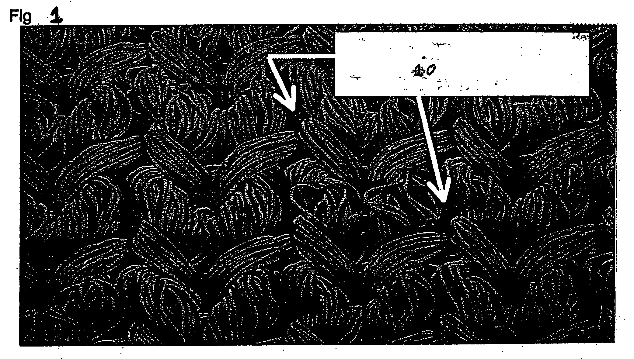 Blood-tight implantable textile material and method of making