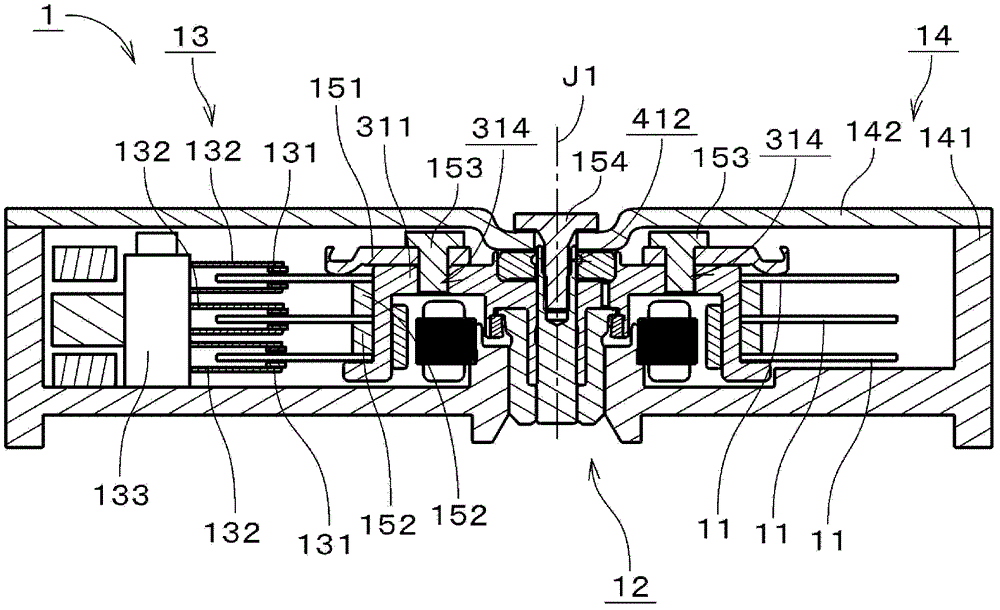 Motor and disk drive device