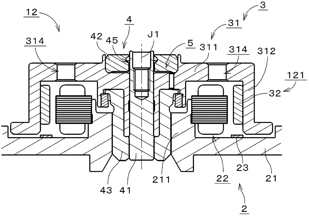 Motor and disk drive device