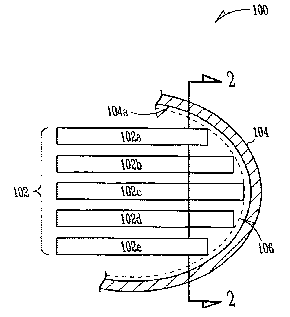 Implantable heart monitors having flat capacitors with curved profiles