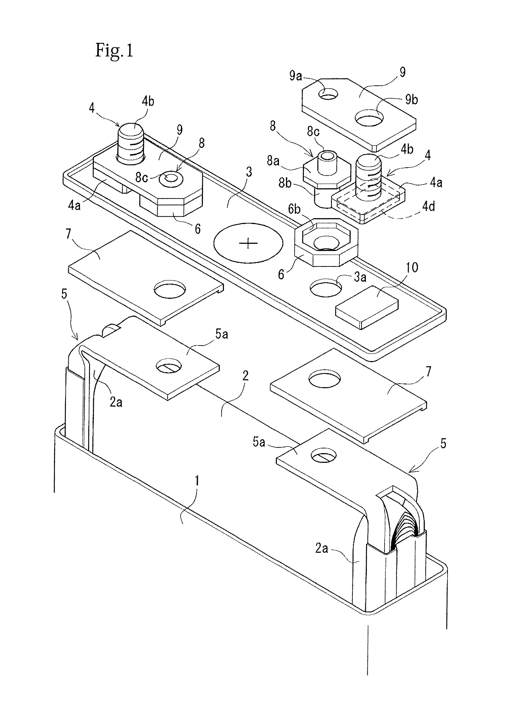 Battery including baffling member and sealing material that seals auxiliary terminal to lid plate