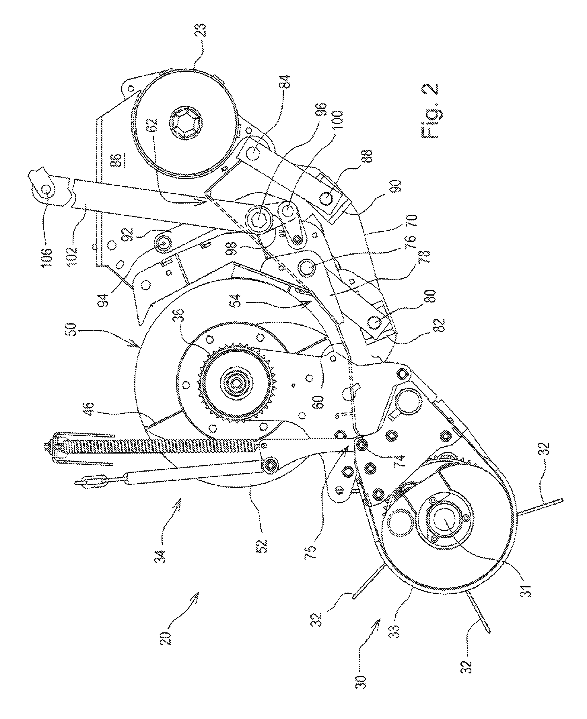 Wide crop pick-up having primary and secondary stripper plates for converging augers respectively mounted to movable crop guide plate portion and to fixed walls behind the augers