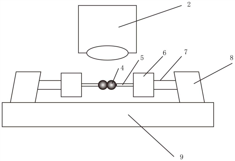 A method and device for measuring agglomeration strength parameters of granular materials through a single solid bridge