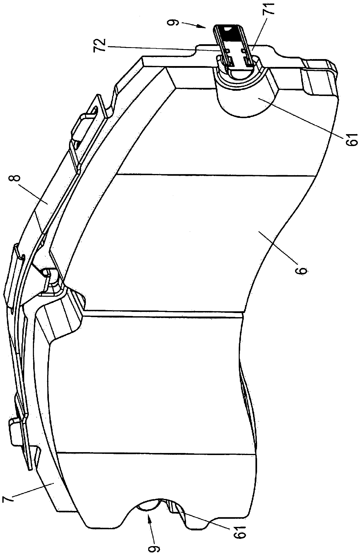 Disk brake having a restoring device and a brake lining