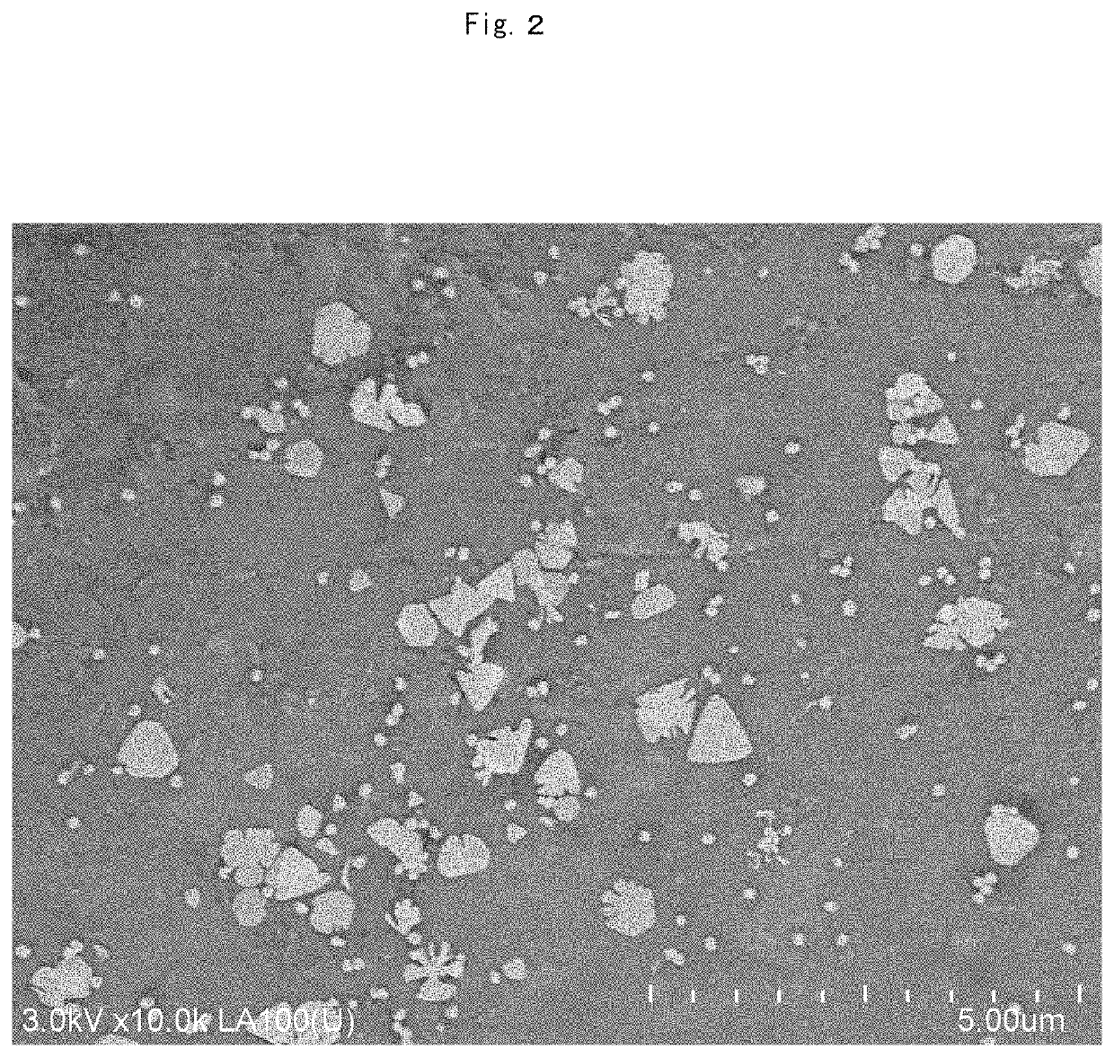 Structure containing metal microparticles