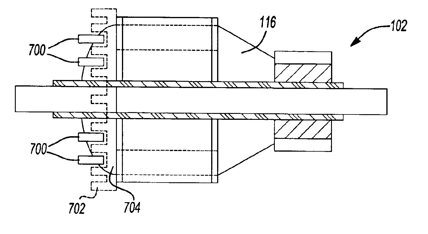 Dynamoelectric machine having encapsulated coil structure with one or more of phase change additives, insert molded features and insulated pinion