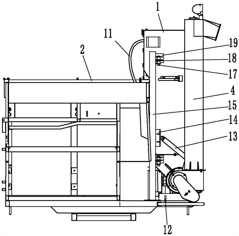 A harvester rotates a large granary