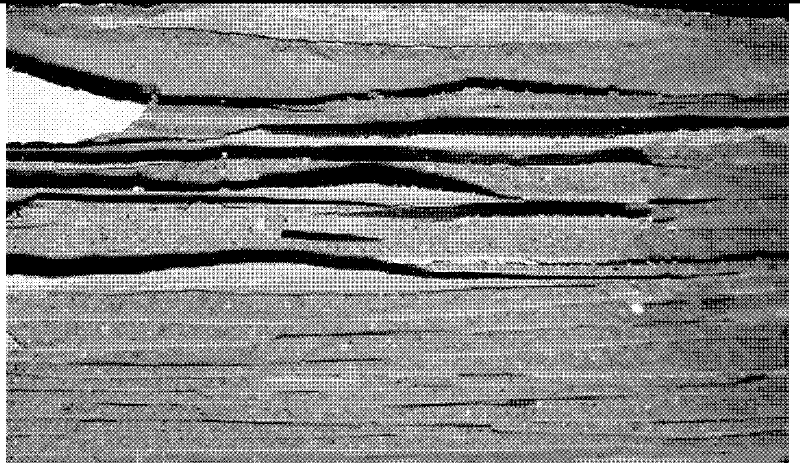 Layered cement-based composite material and its preparation method