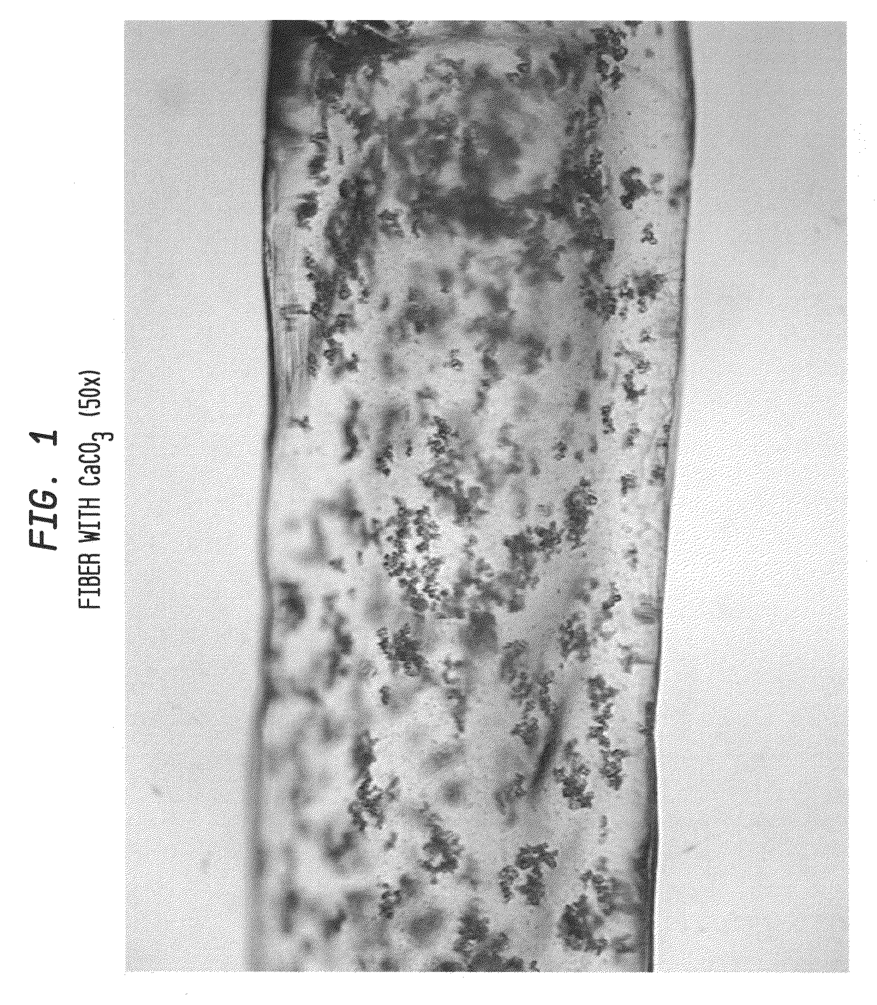 Inflated filbers of regenerated cellulose formed from ionic liguid/cellulose dope and related products