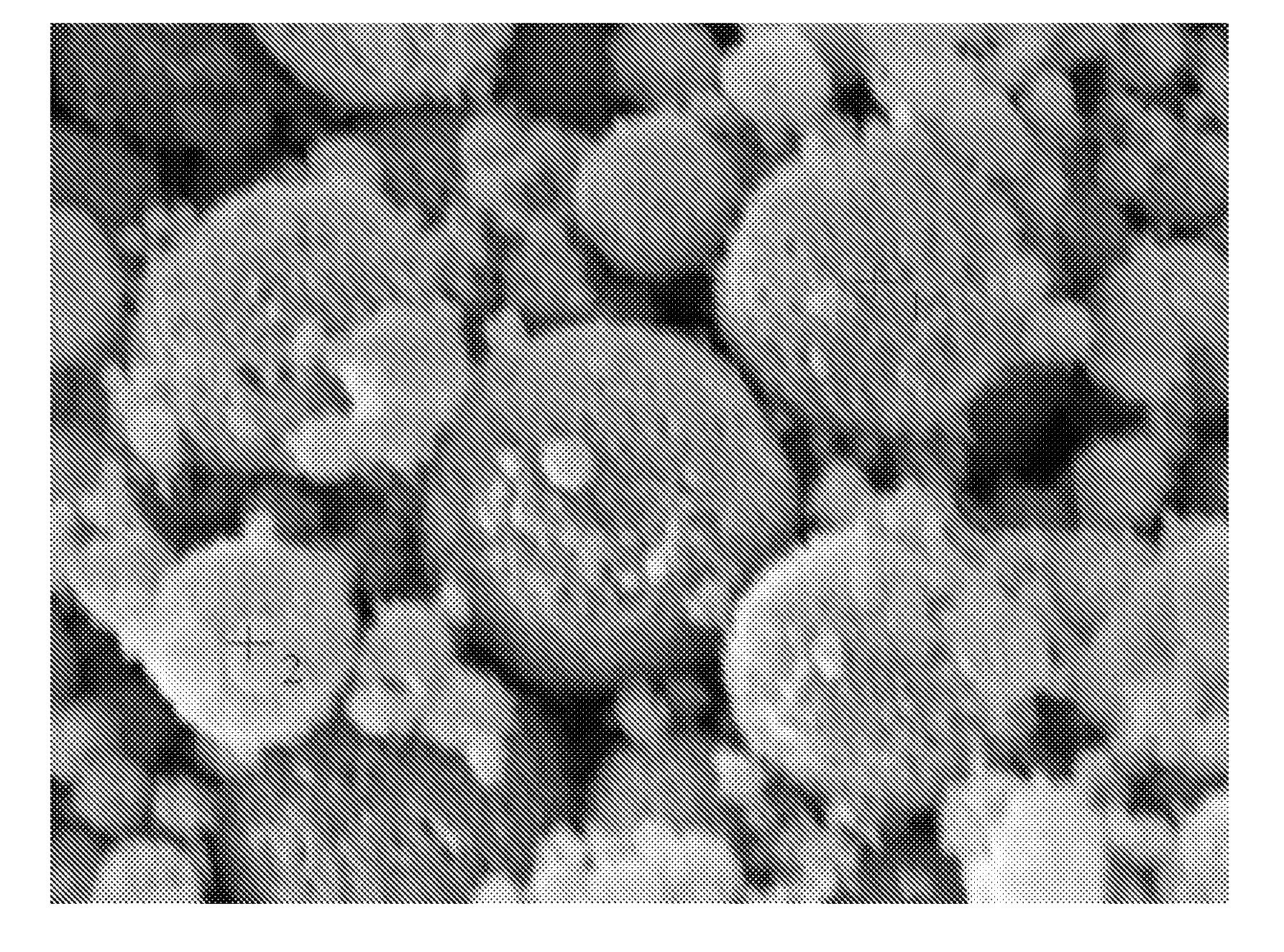 Surface treatment of electrochemically active materials for rechargeable cells