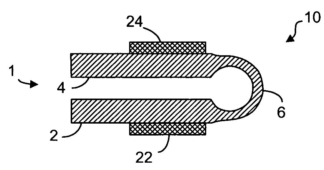 Plastic living hinge with metal support