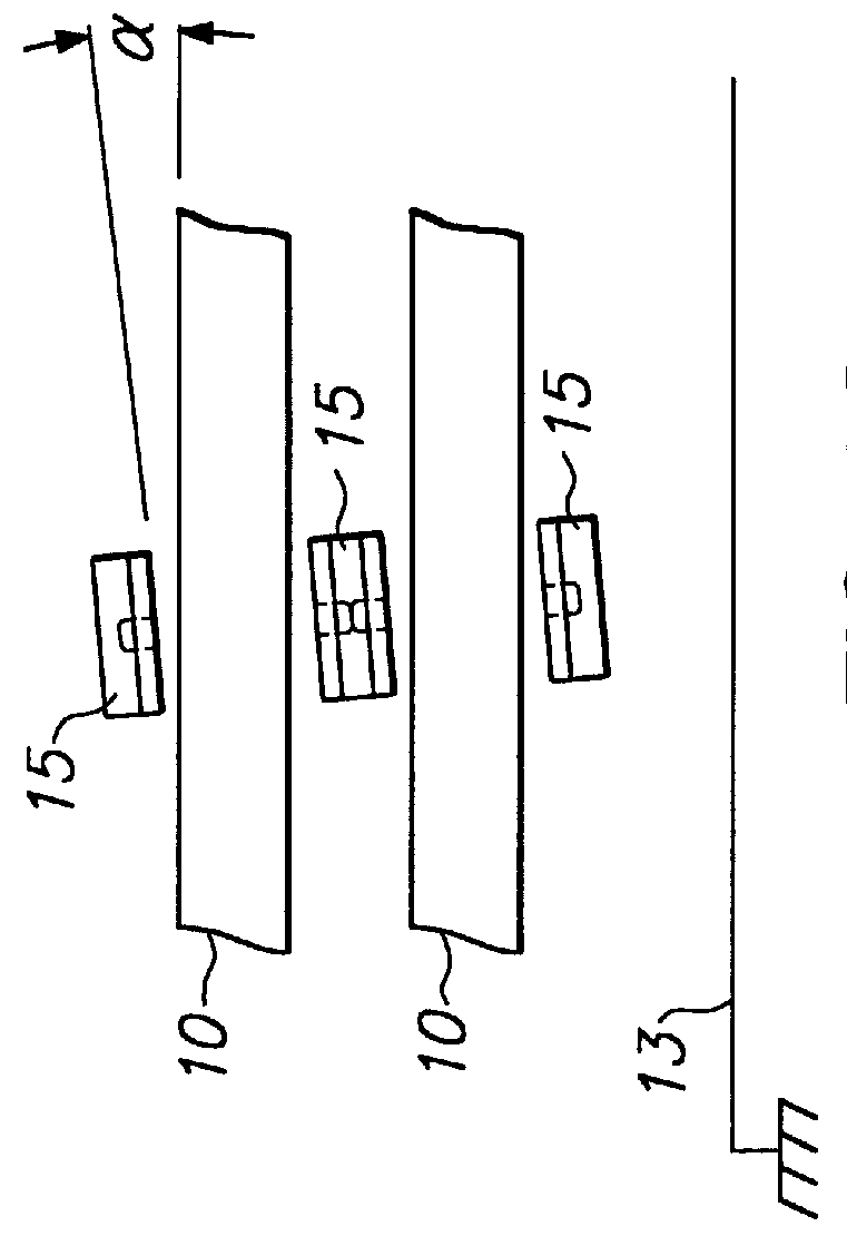 Roll-biased head suspension for reduced track misregistration