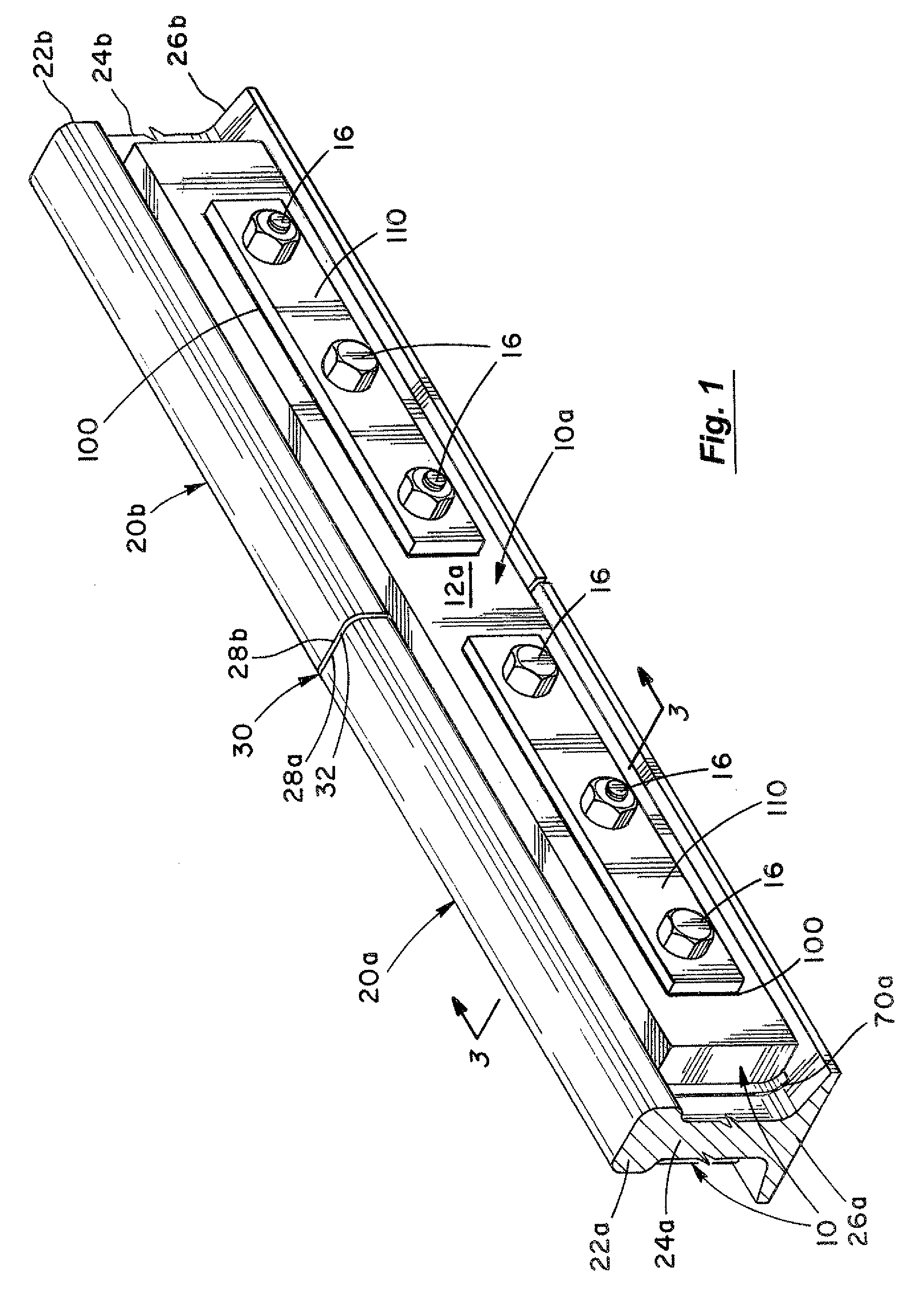 Rail joint assembly using embedded load transfer keys and method therefor