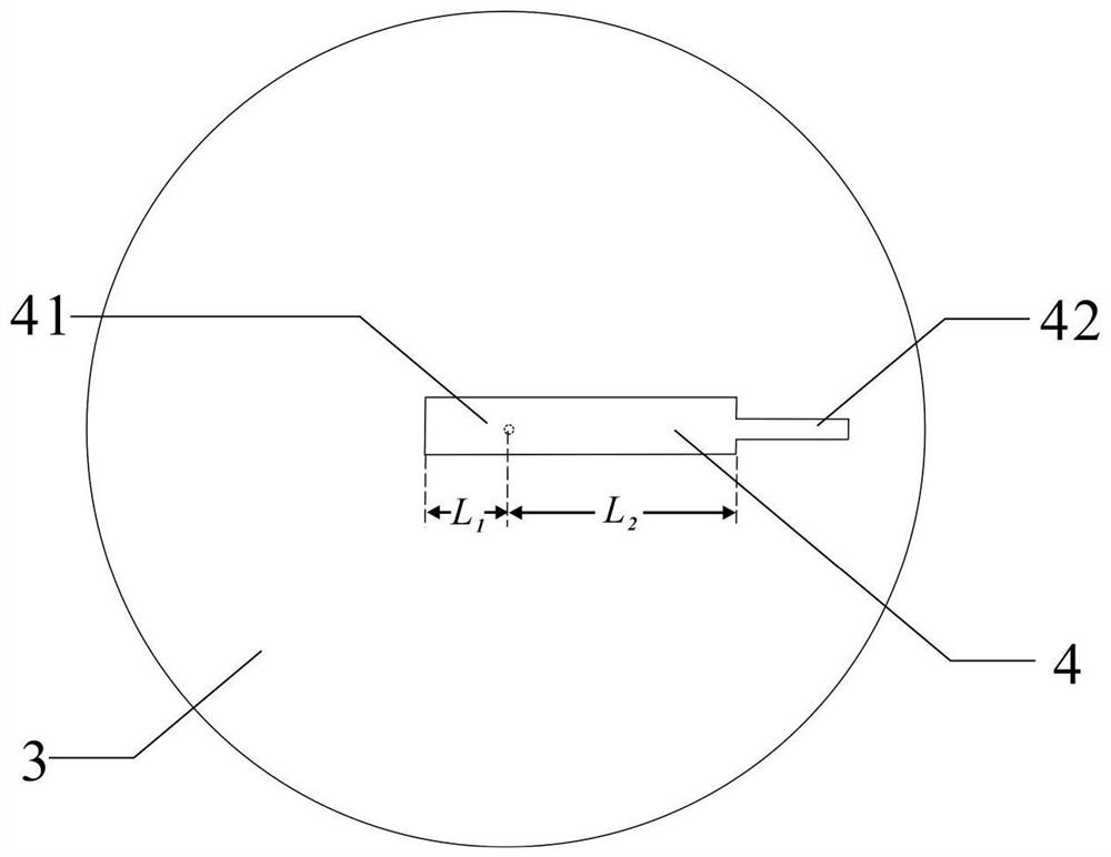 A broadband low-profile dielectric resonant antenna and a wireless communication system