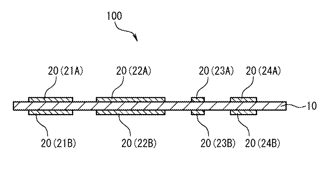 Insulating material, passive element, circuit board, and method of manufacturing an insulating sheet