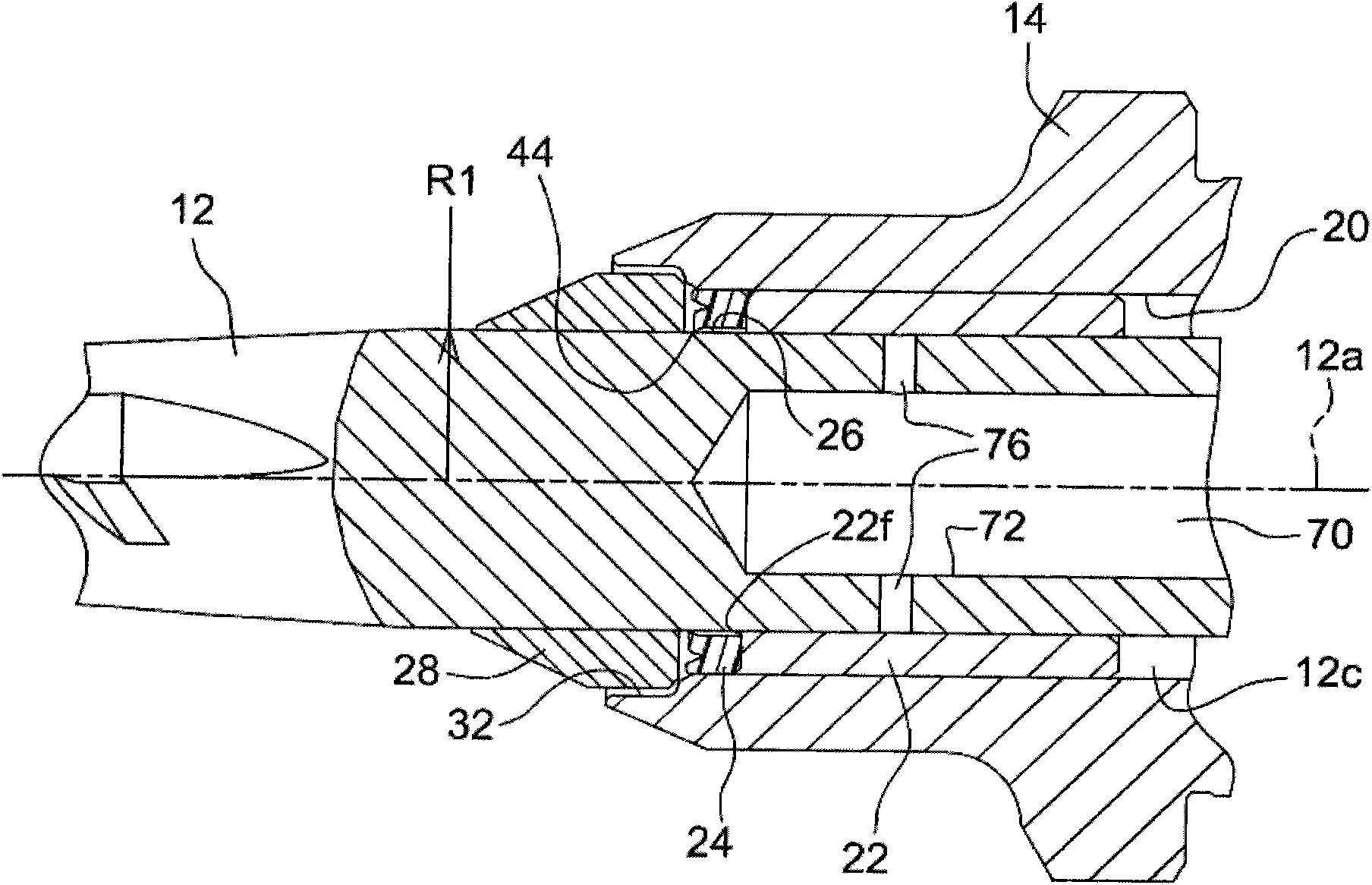 Cotton picker spindle with grease reservoir and a grease and dirt seal