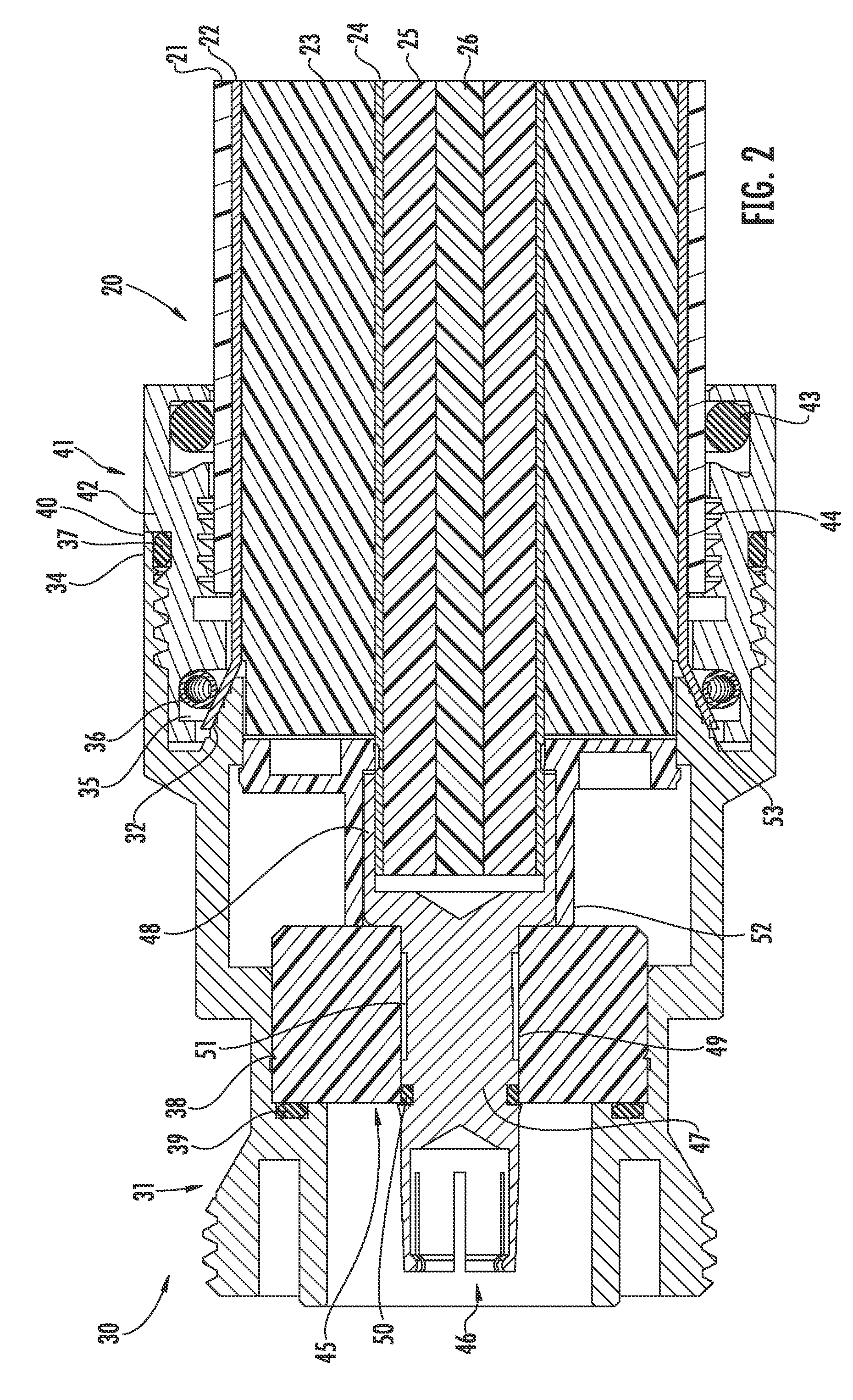 Connector for coaxial cable having rotational joint between insulator member and connector housing and associated methods