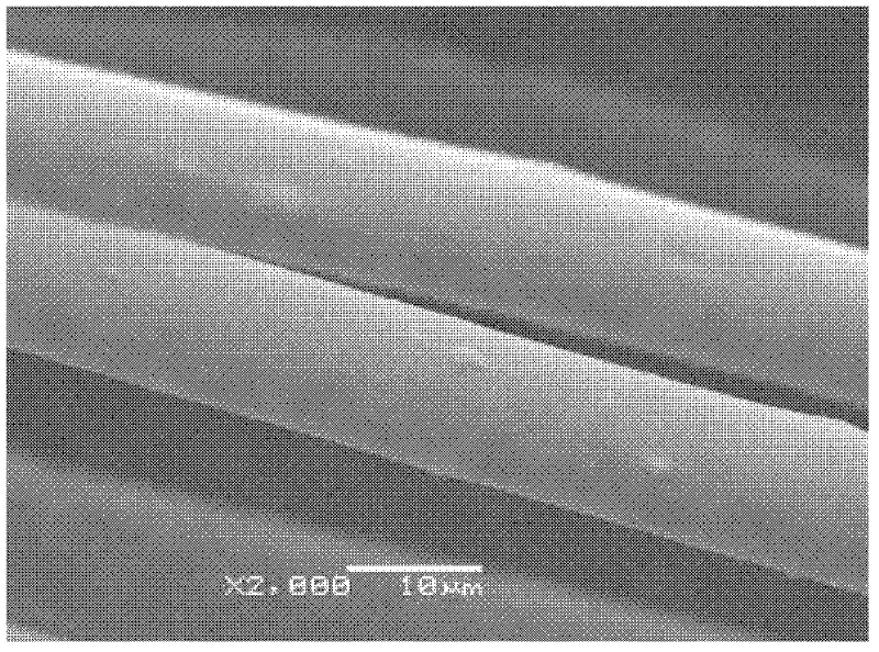 Knitted fabric containing volcanic ash microcrystal particles and preparation method thereof