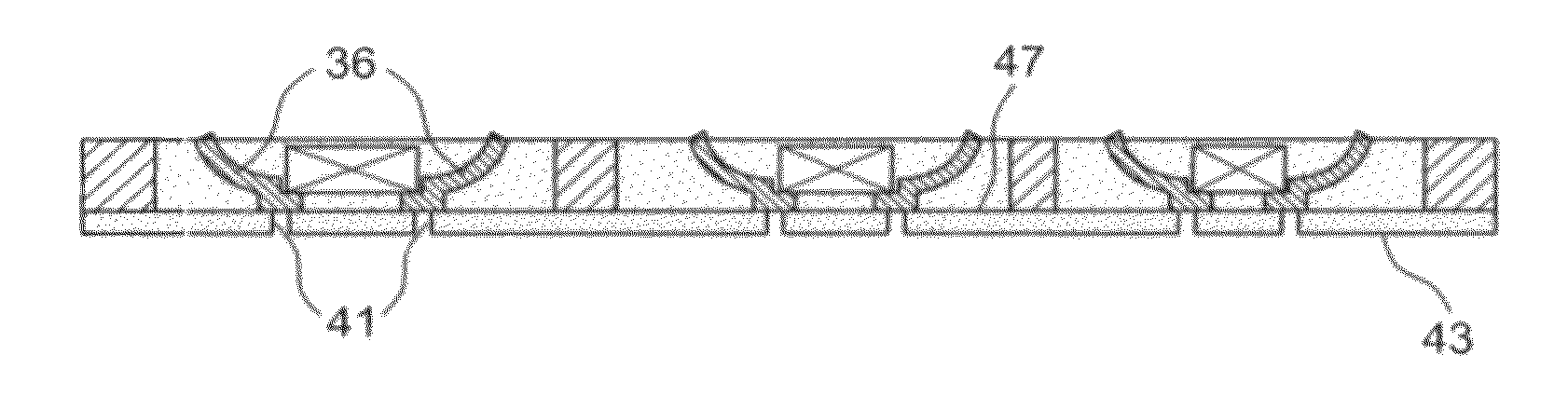 Method of producing a via in a reconstituted substrate